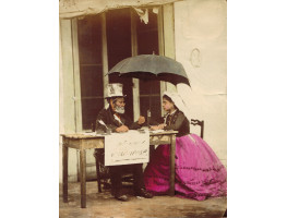 'La Scrivano'. Italian public letter writer, seated at table with young lady under umbrella.