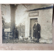 'W.H. Patterson with terriers Jack & ? Twile', outside Knocknoney National School taken by Robert M. Patterson, his son.