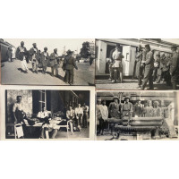 Collection of 23 black and white photographs, three of Turkish and Indian wounded at station arriving from Suez canal, (inscribed on reverse), military band, army processions, one including armoured car, operating table, wounded in ward and on terrace, Ma